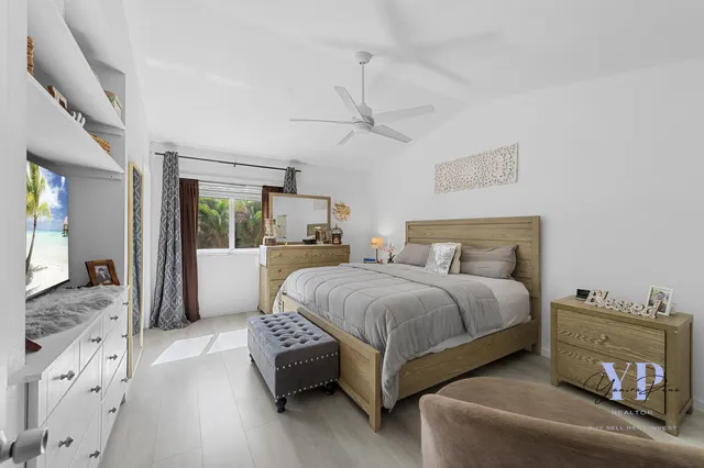 a spacious bedroom with a bed and a couch