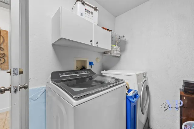 a utility room with dryer and washer