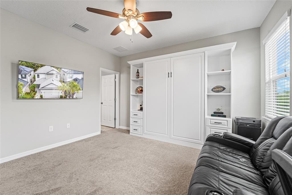 8903 Arabella Lane Seminole, FL 33777 - Photo 32 of 47 a living room with furniture and a window