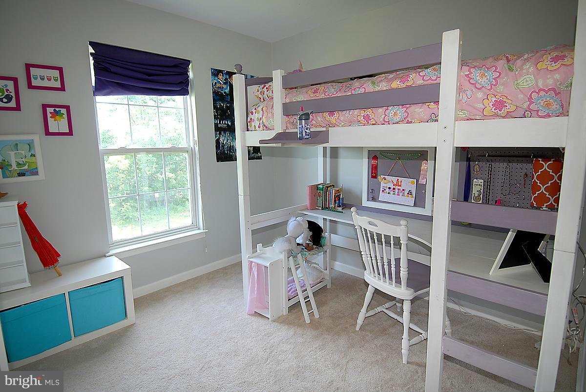 43233 Stillforest Terrace Ashburn, VA 20147 - Photo 24 of 30 a room with furniture and a window