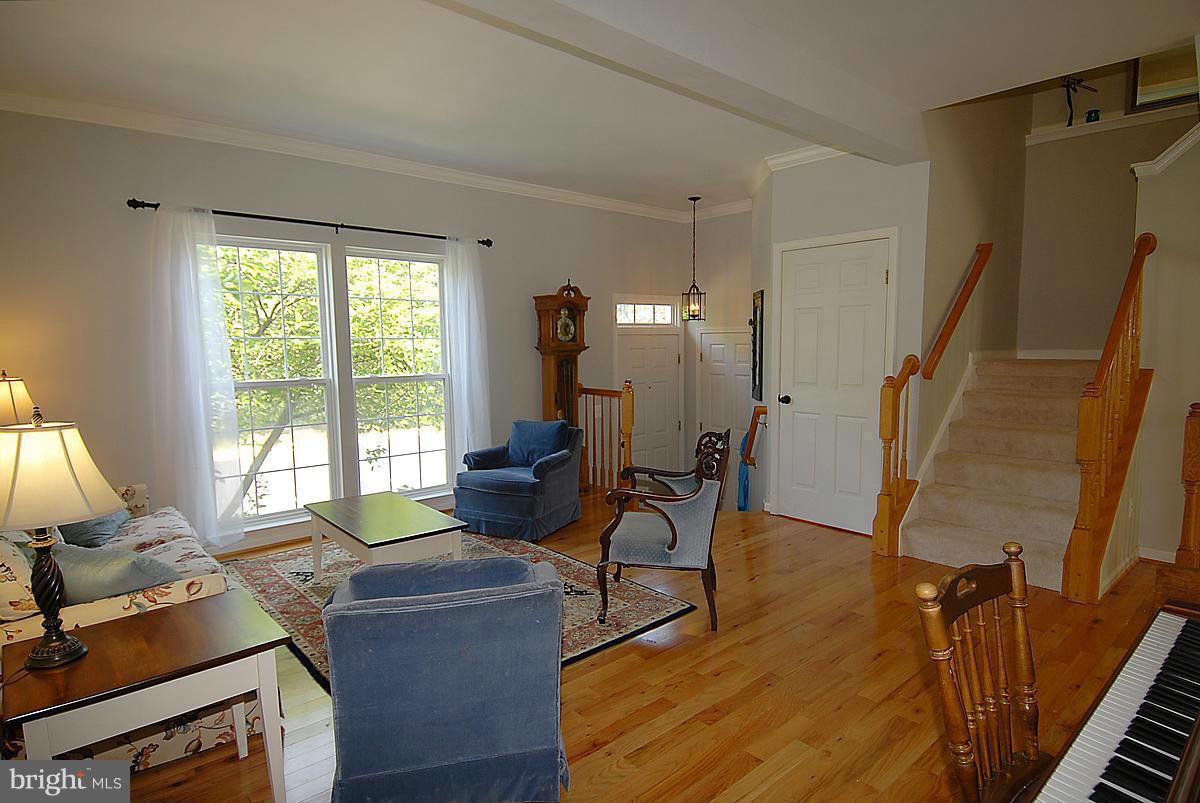 43233 Stillforest Terrace Ashburn, VA 20147 - Photo 4 of 30 a living room with furniture and a window