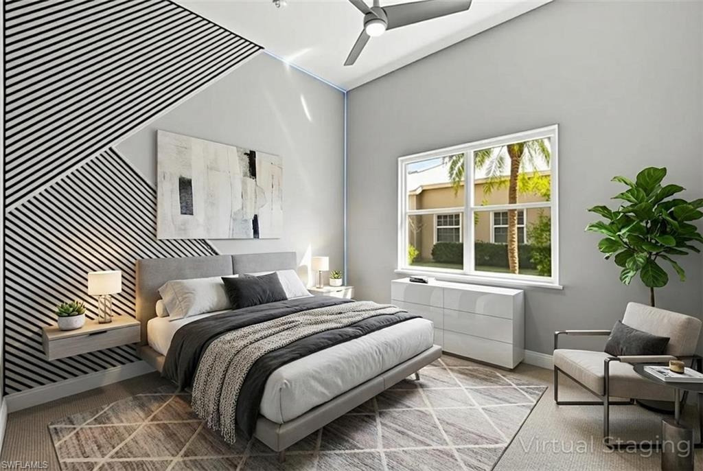 480 Terracina Way Naples, FL 34119 - Photo 20 of 40 Bedroom featuring an accent wall and a ceiling fan