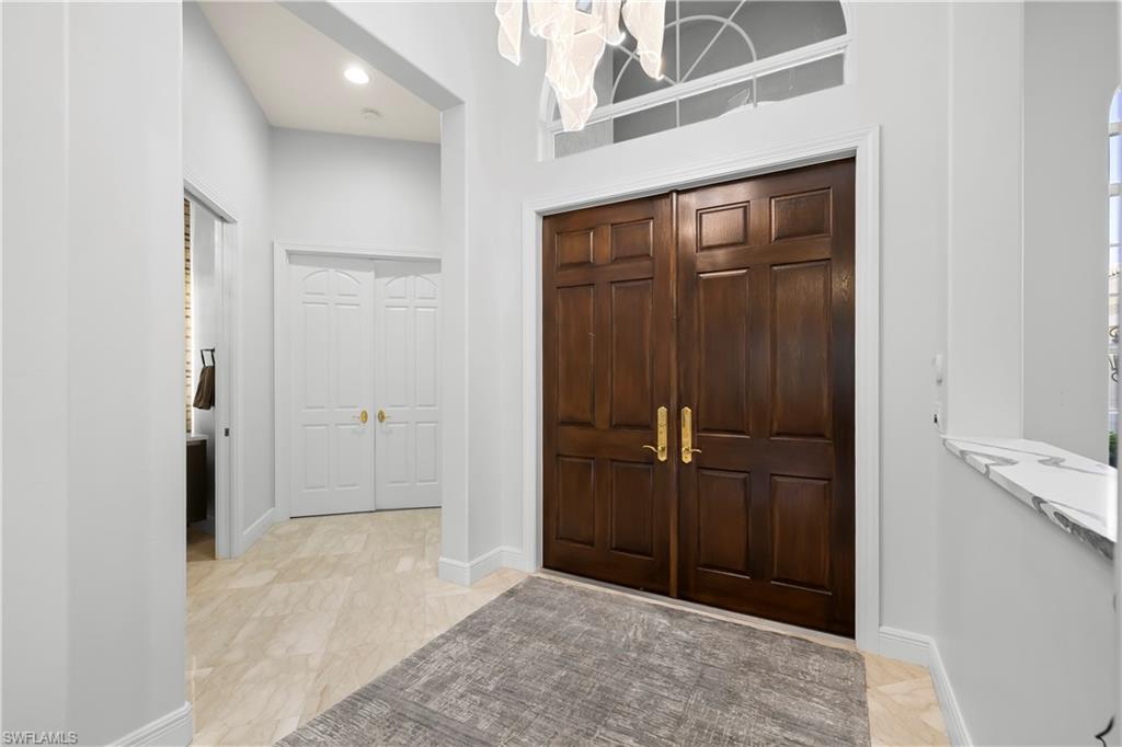 480 Terracina Way Naples, FL 34119 - Photo 27 of 40 Entrance foyer with recessed lighting and a high ceiling