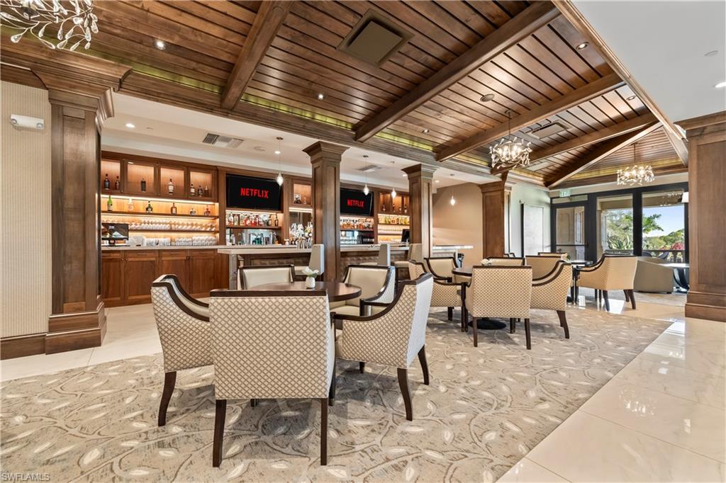 480 Terracina Way Naples, FL 34119 - Photo 34 of 40 Building lobby with a wooden ceiling with exposed beams and recessed lighting