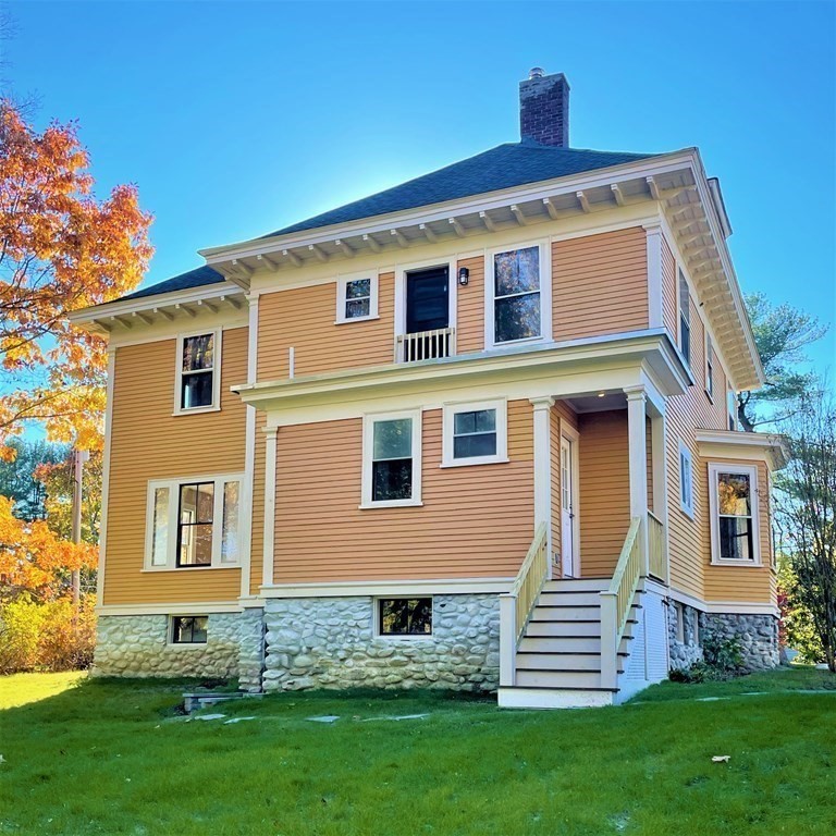 10 Harvard Road Shirley, MA 01464 - Photo 19 of 23 a front view of a house with a garden