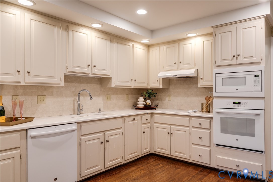 8902 Ginger Way Court Henrico, VA 23229 - Photo 17 of 34 a kitchen with white cabinets white stainless steel appliances and sink