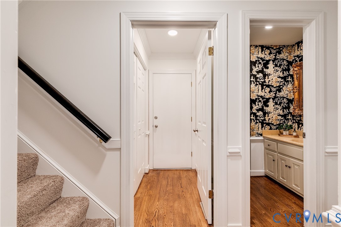 8902 Ginger Way Court Henrico, VA 23229 - Photo 18 of 34 a view of a hallway with wooden floor and staircase