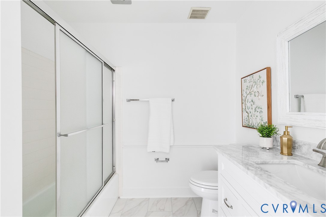 8902 Ginger Way Court Henrico, VA 23229 - Photo 26 of 34 a bathroom with a granite countertop sink toilet and shower