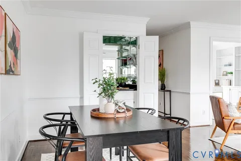 a view of a dining room with furniture window and wooden floor