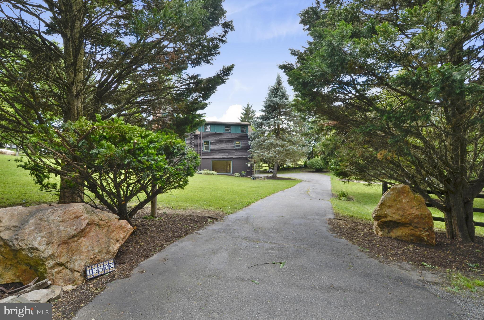 15500 Comus Road Clarksburg, MD 20871 - Photo 26 of 30 a view of a house with a yard and large tree