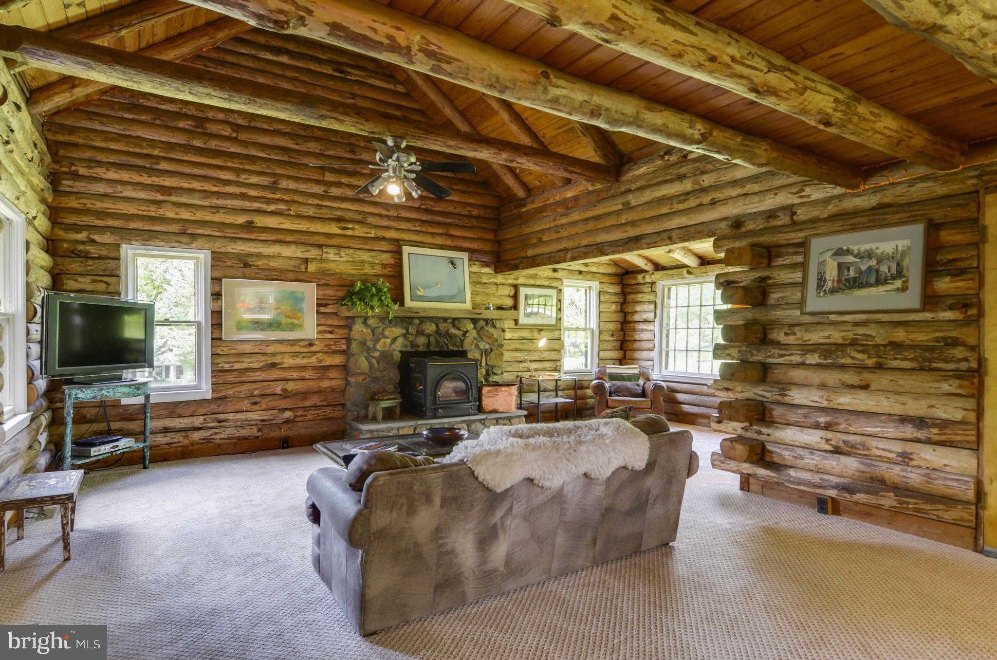 15500 Comus Road Clarksburg, MD 20871 - Photo 6 of 30 a living room with fireplace furniture and a flat screen tv