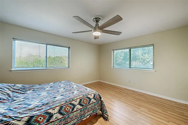 a bedroom with bed and window