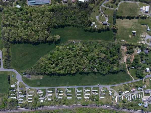 an aerial view of lake and residential houses with outdoor space