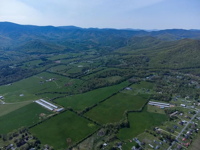 an aerial view of a residential apartment building with a garden