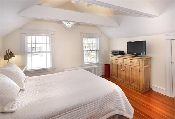 5 Marshall Road Winchester, MA 01890 - Photo 16 of 22 a bedroom with a bed and a flat screen tv
