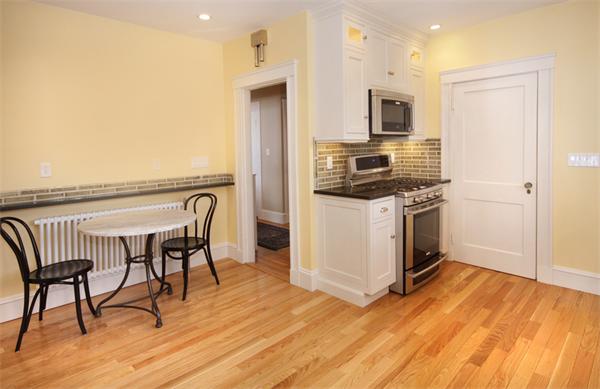 5 Marshall Road Winchester, MA 01890 - Photo 7 of 22 a kitchen with stainless steel appliances a stove top oven a sink dishwasher and a refrigerator