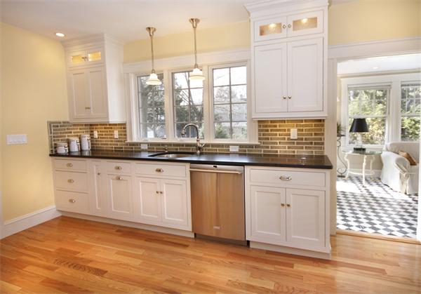 5 Marshall Road Winchester, MA 01890 - Photo 8 of 22 a kitchen with stainless steel appliances granite countertop a sink a stove and cabinets
