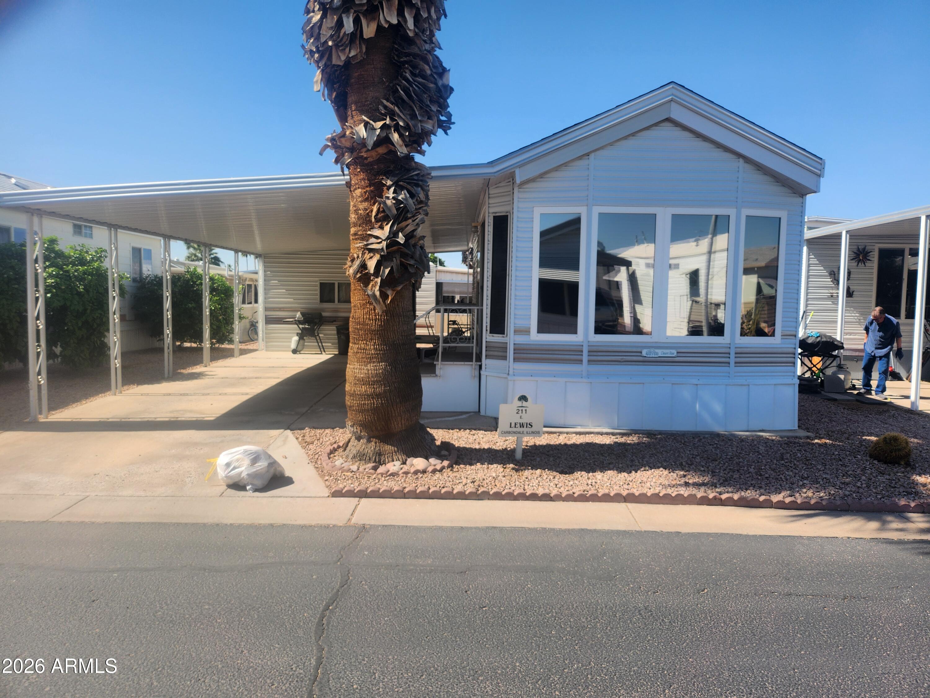 111 South Greenfield Road, Unit 211 Mesa, AZ 85206 - Photo 4 of 6 front view of a house with a porch