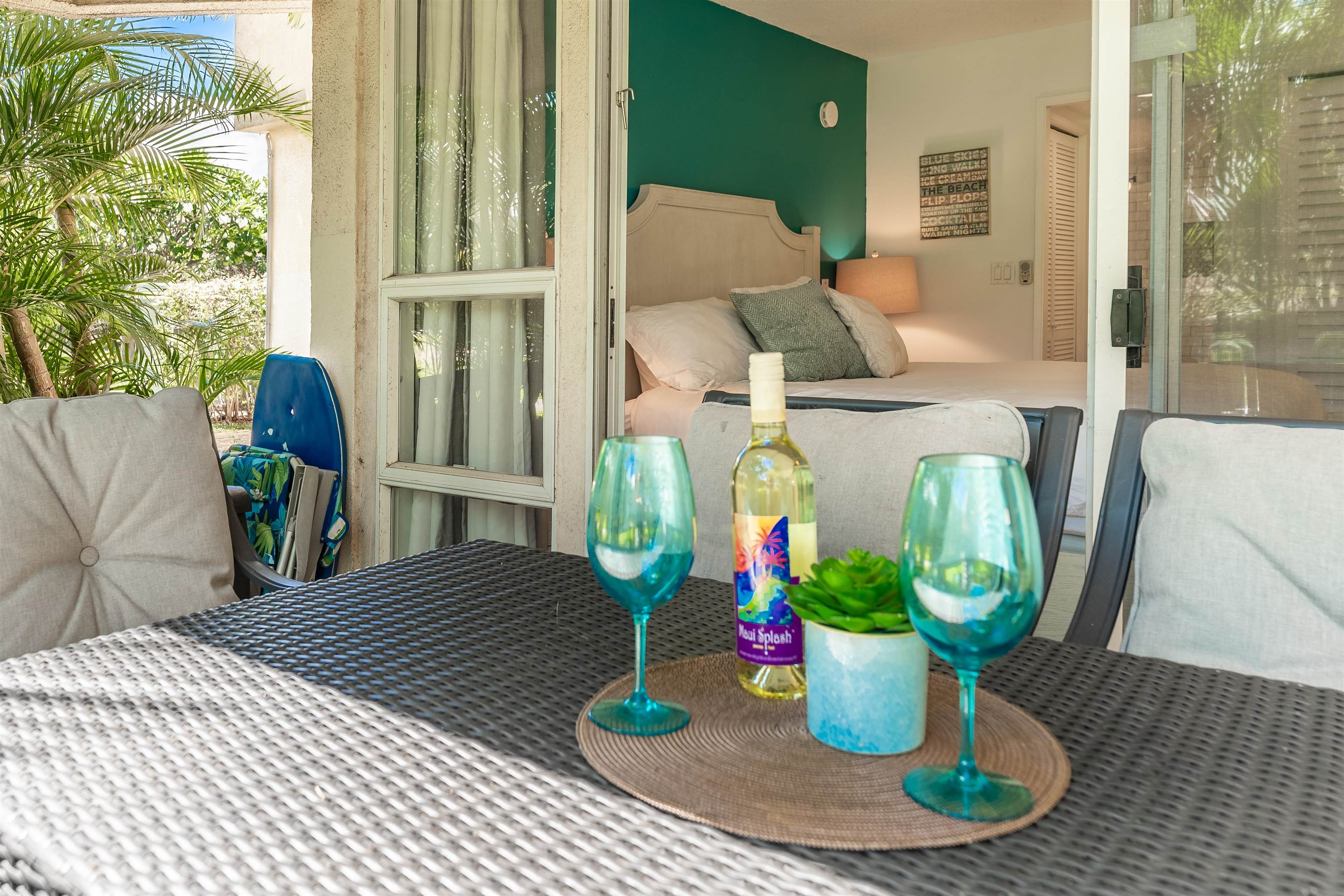 2575 South Kihei Road, Unit T110 Kihei, HI 96753 - Photo 16 of 24 a view of a dining room with furniture a potted plant and wooden floor