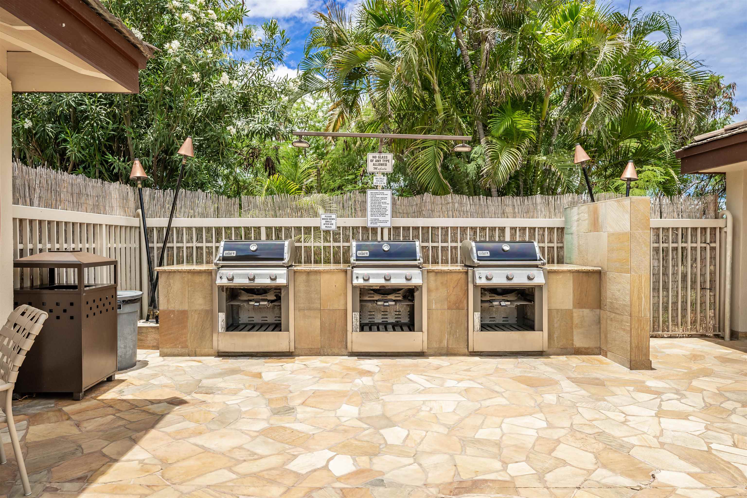 2575 South Kihei Road, Unit T110 Kihei, HI 96753 - Photo 20 of 24 a view of roof deck with a barbeque and wooden stairs