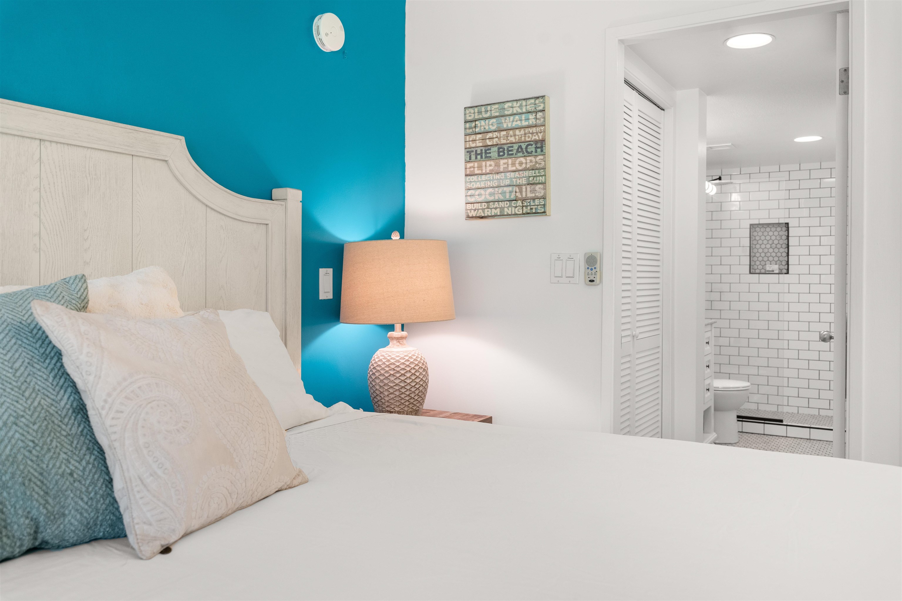 2575 South Kihei Road, Unit T110 Kihei, HI 96753 - Photo 7 of 24 a bedroom with a bed and a cabinets