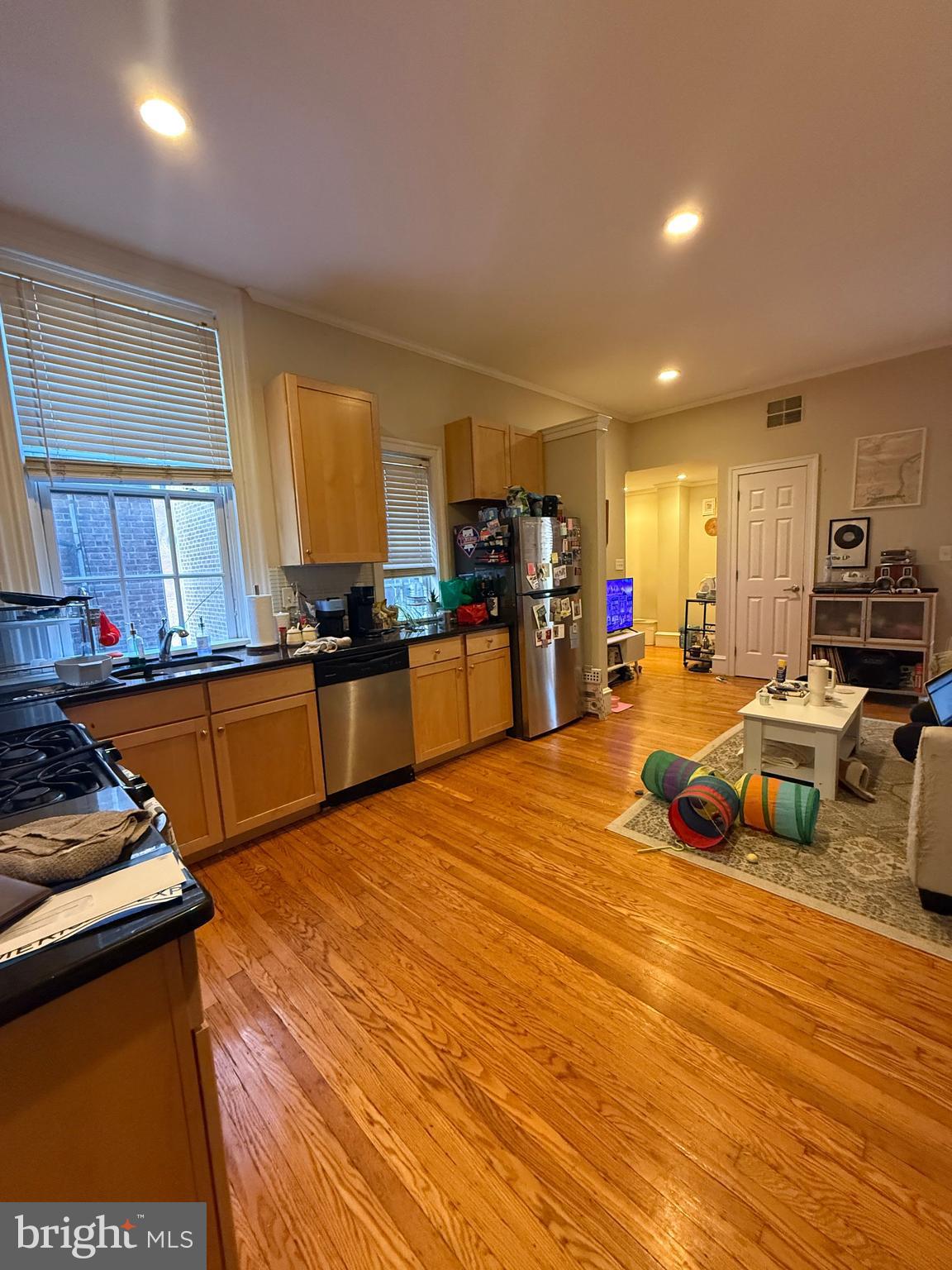 1602 Spruce Street, Unit 2R Philadelphia, PA 19103 - Photo 6 of 11 a kitchen with stainless steel appliances granite countertop a stove a sink and a refrigerator