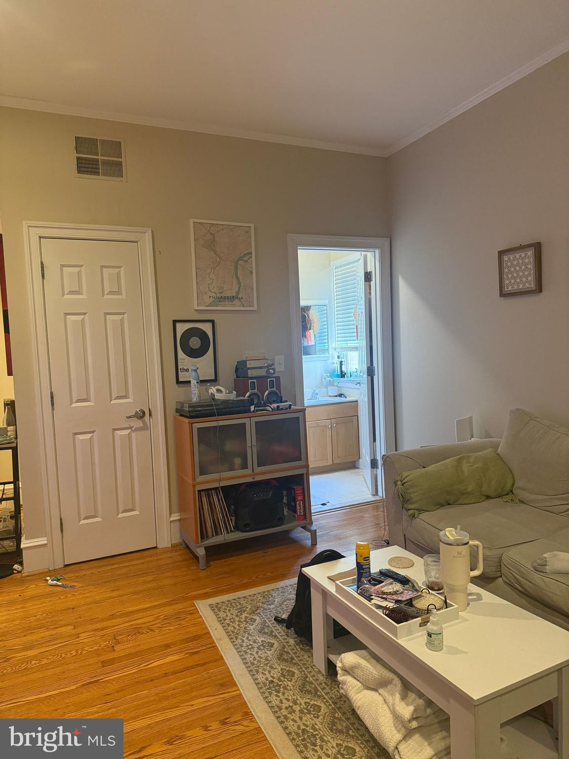 1602 Spruce Street, Unit 2R Philadelphia, PA 19103 - Photo 8 of 11 a living room with furniture and a wooden floor