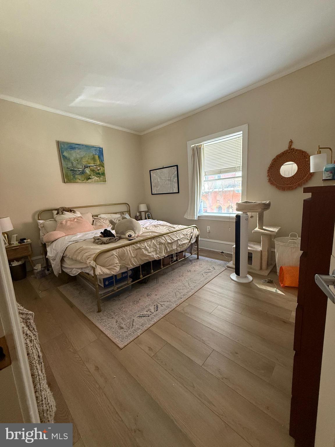 1602 Spruce Street, Unit 2R Philadelphia, PA 19103 - Photo 9 of 11 a spacious bedroom with a bed and wooden floor