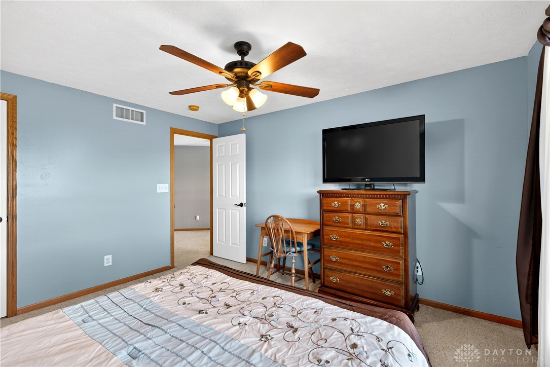 6560 Snyder Road Fletcher, OH 45326 - Photo 35 of 71 This inviting bedroom features soft lighting and neutral tones for ultimate comfort.