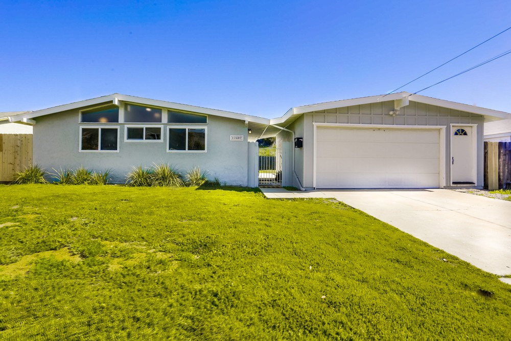 a front view of a house with yard
