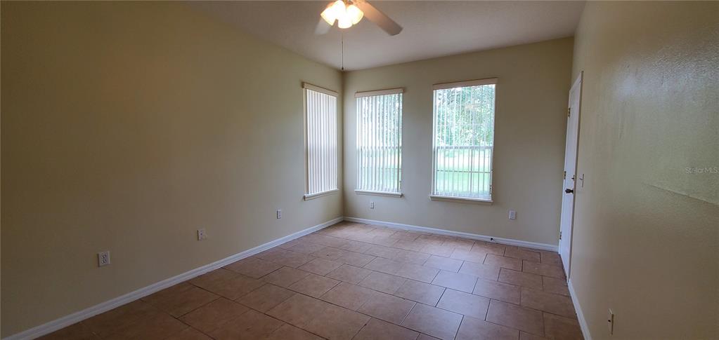 356 Monroe Circle Davenport, FL 33896 - Photo 4 of 9 a view of an empty room with a window