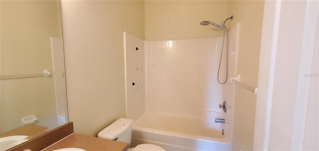 356 Monroe Circle Davenport, FL 33896 - Photo 7 of 9 a bathroom with a bathtub and a shower