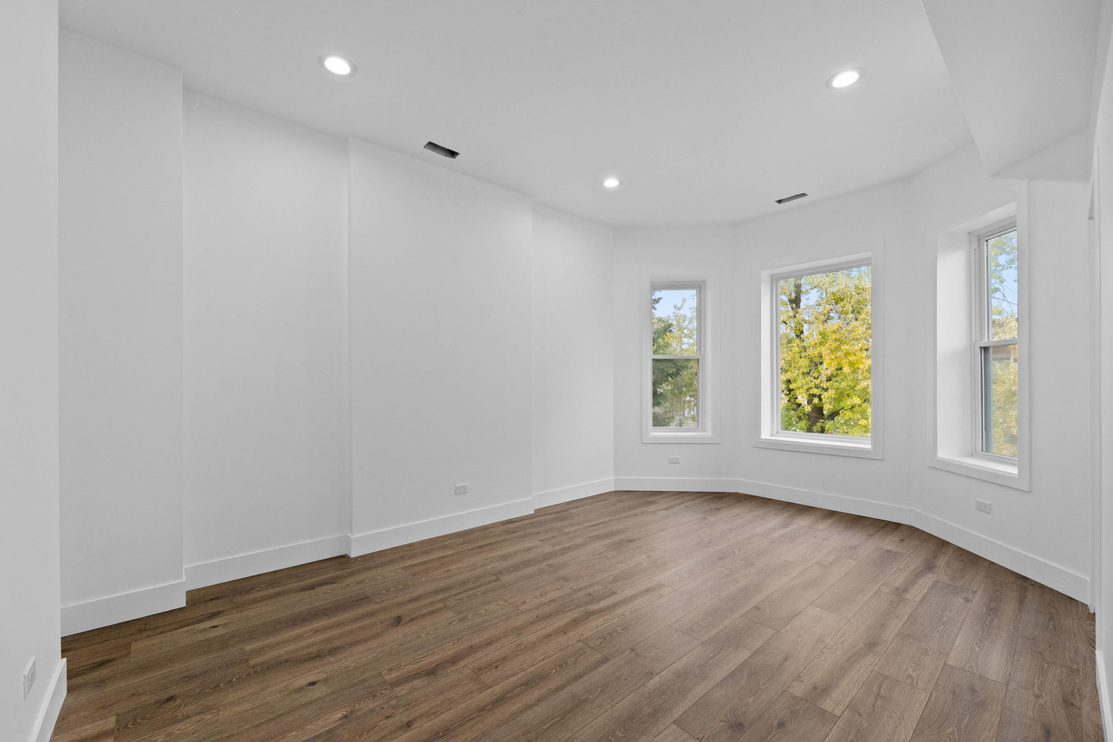 1421 East 69th Place Chicago, IL 60637 - Photo 4 of 14 a view of room with window and wooden floor