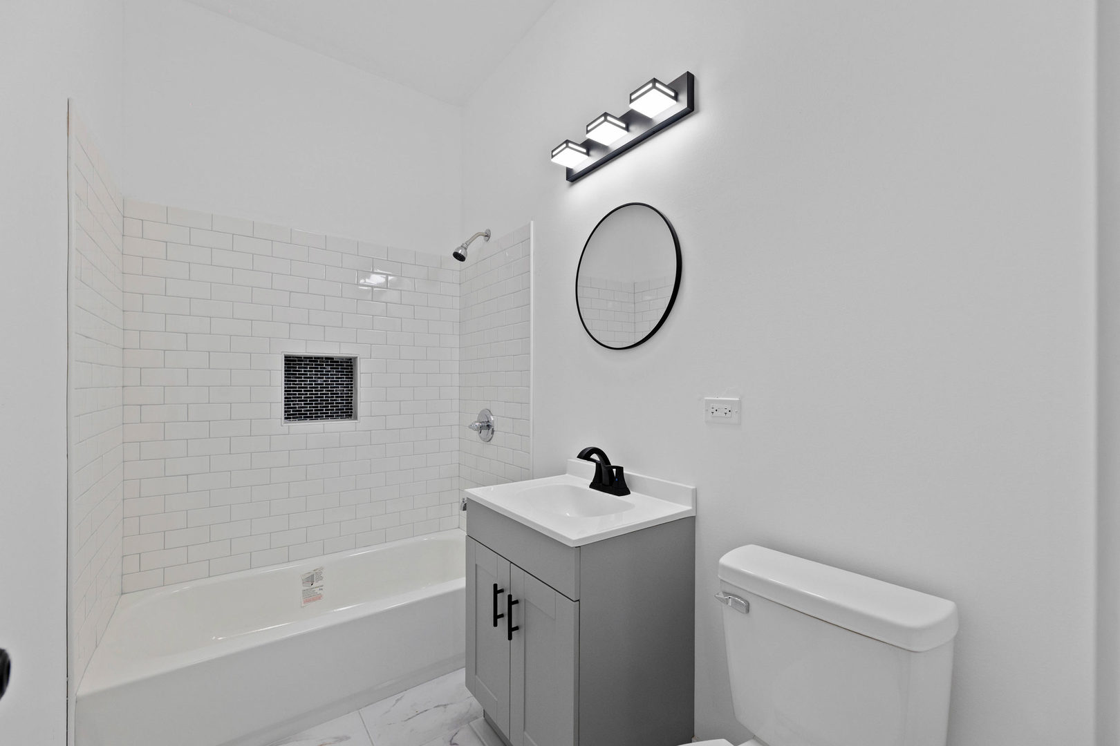 1421 East 69th Place Chicago, IL 60637 - Photo 6 of 14 a bathroom with a sink and a toilet