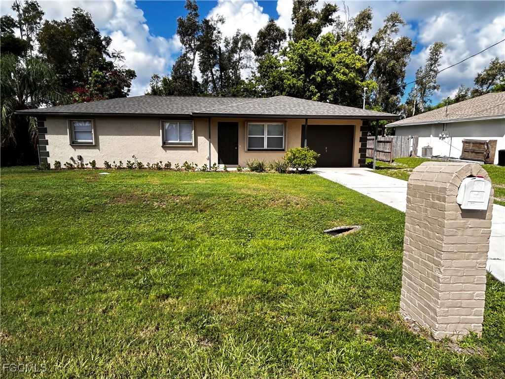 18592 Matanzas Road Fort Myers, FL 33967 - Photo 1 of 25 a front view of house with a garden
