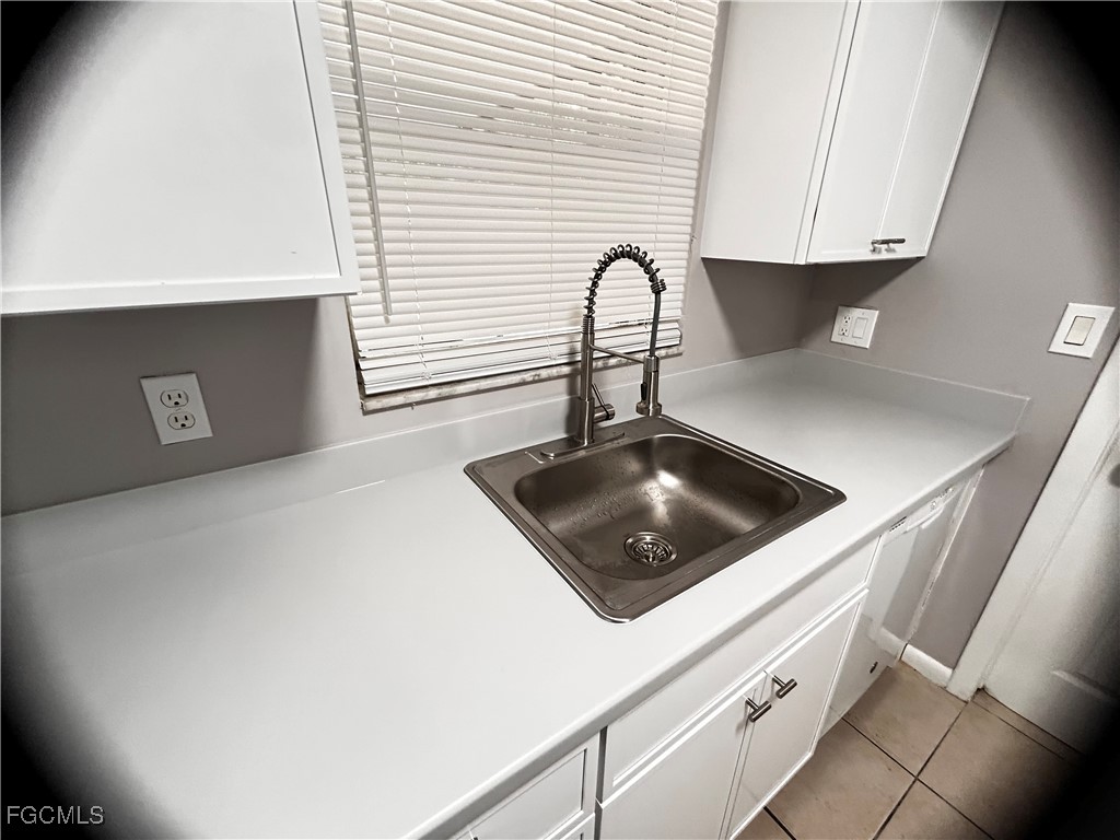 18592 Matanzas Road Fort Myers, FL 33967 - Photo 12 of 25 a close view of a sink a faucet and appliance in the kitchen