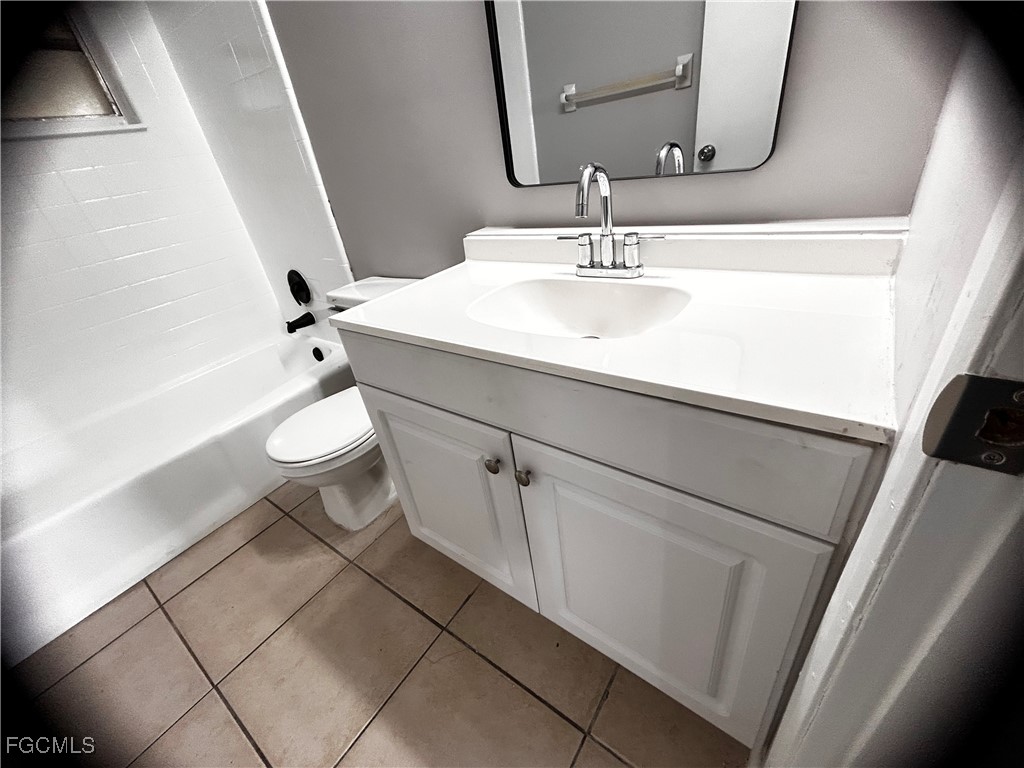 18592 Matanzas Road Fort Myers, FL 33967 - Photo 16 of 25 a bathroom with a sink a toilet and tub