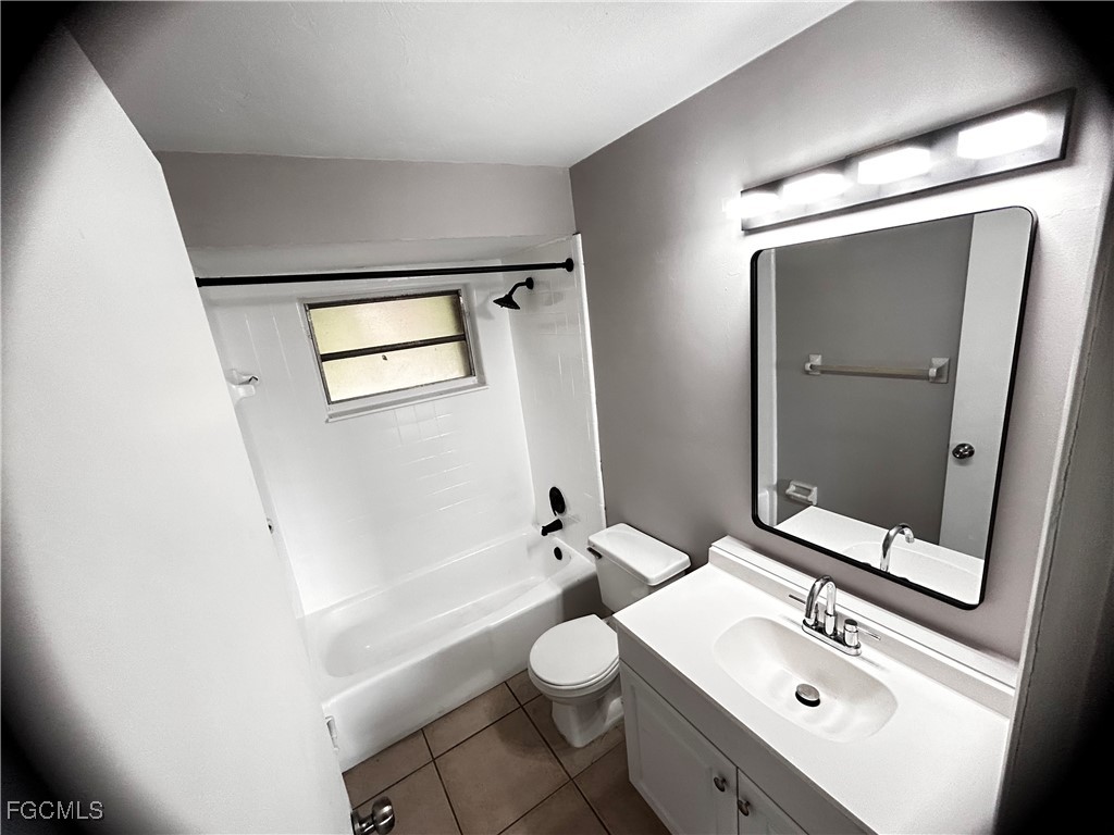 18592 Matanzas Road Fort Myers, FL 33967 - Photo 17 of 25 a bathroom with a toilet sink and mirror