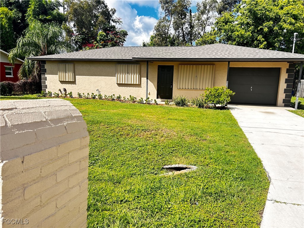 18592 Matanzas Road Fort Myers, FL 33967 - Photo 2 of 25 a front view of house with yard