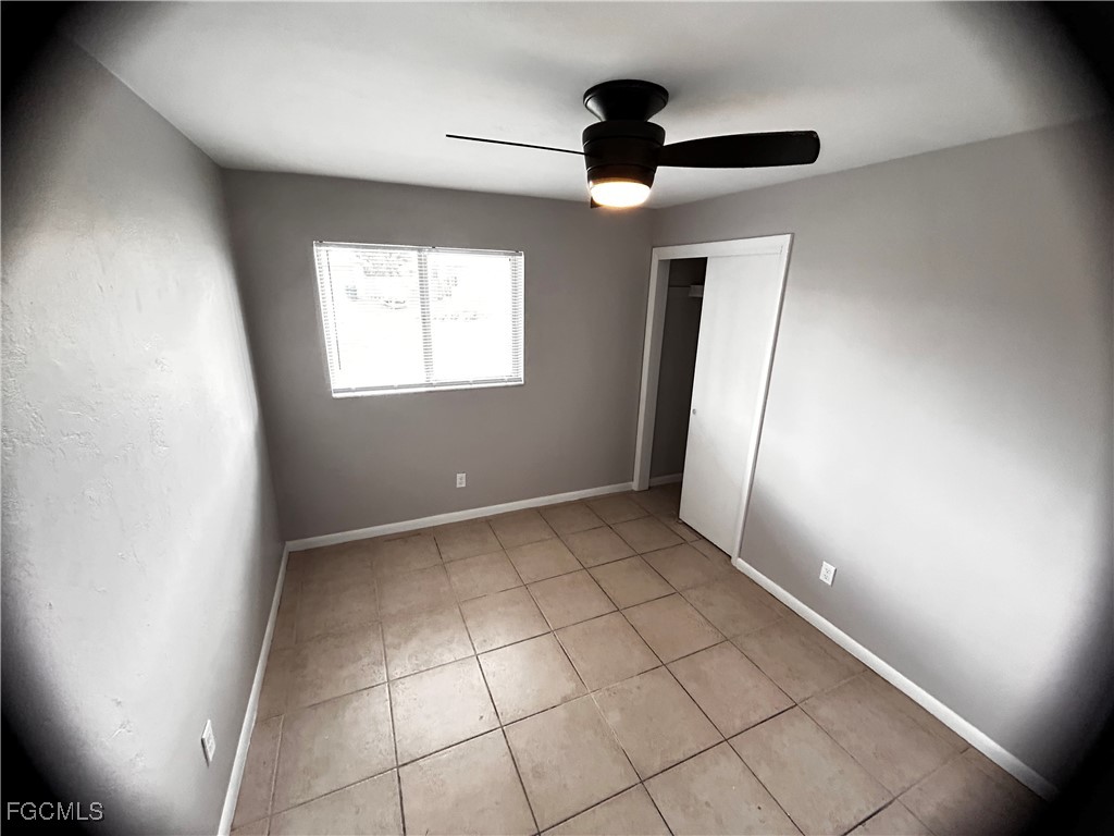 18592 Matanzas Road Fort Myers, FL 33967 - Photo 25 of 25 wooden floor in an empty room with a window