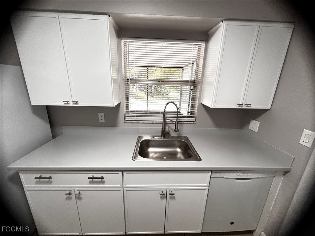 18592 Matanzas Road Fort Myers, FL 33967 - Photo 10 of 25 a kitchen with a white cabinets and a sink