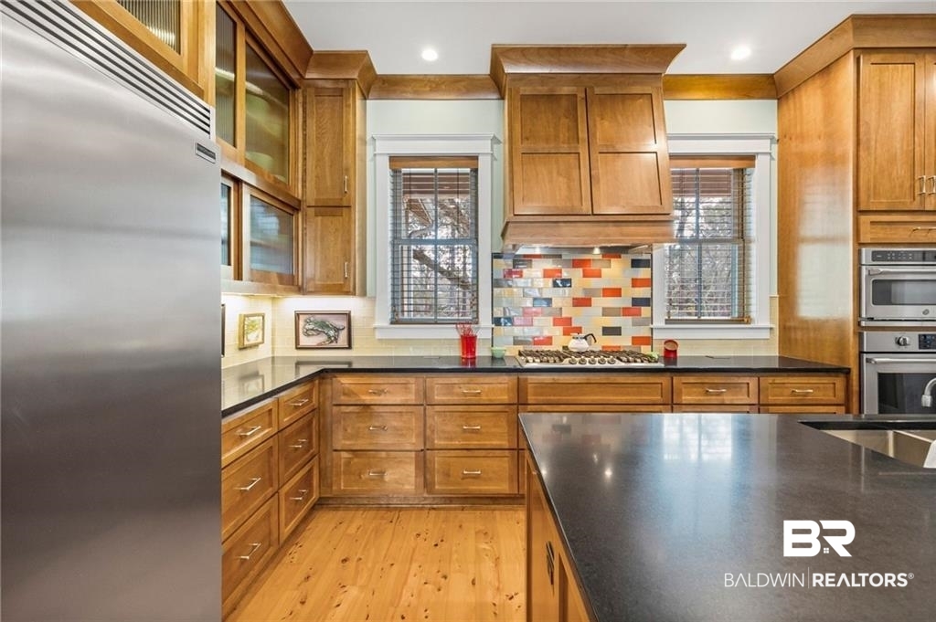 2730 Gator Road Mobile, AL 36605 - Photo 11 of 42 Kitchen featuring stainless steel appliances, wood finish cabinetry, healthy amount of natural light, and recessed lighting