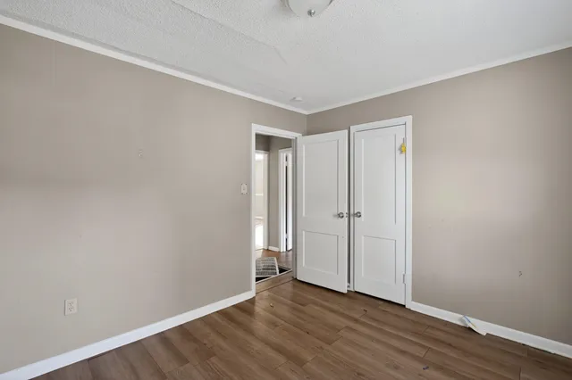 a bathroom with a bathtub shower sink vanity and toilet