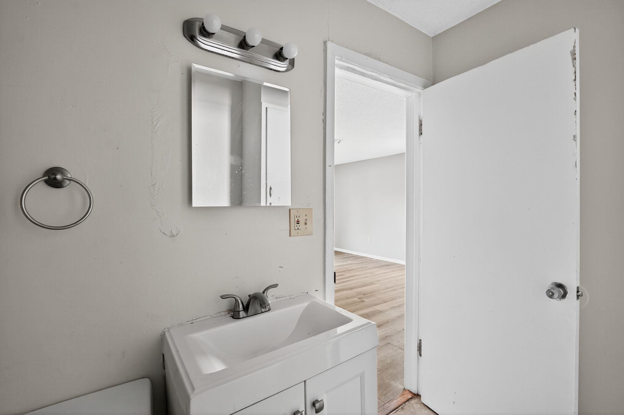 1730 South Sutton Drive Memphis, TN 38127 - Photo 21 of 32 a bathroom with a sink and a mirror