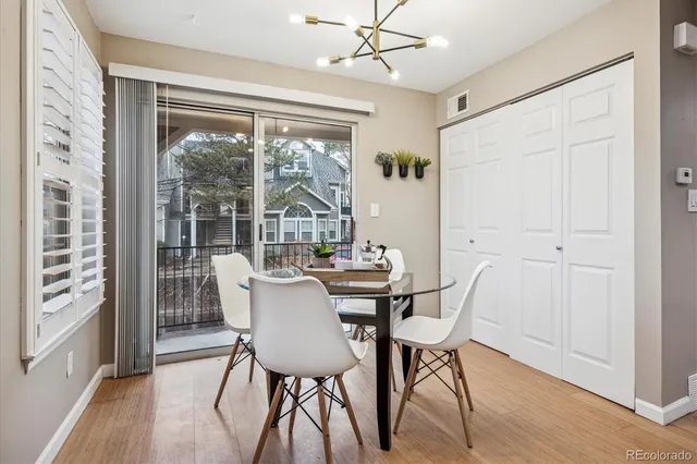 a view of a dining room with furniture window and wooden floor