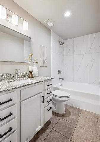 a bathroom with a sink a toilet and bathtub