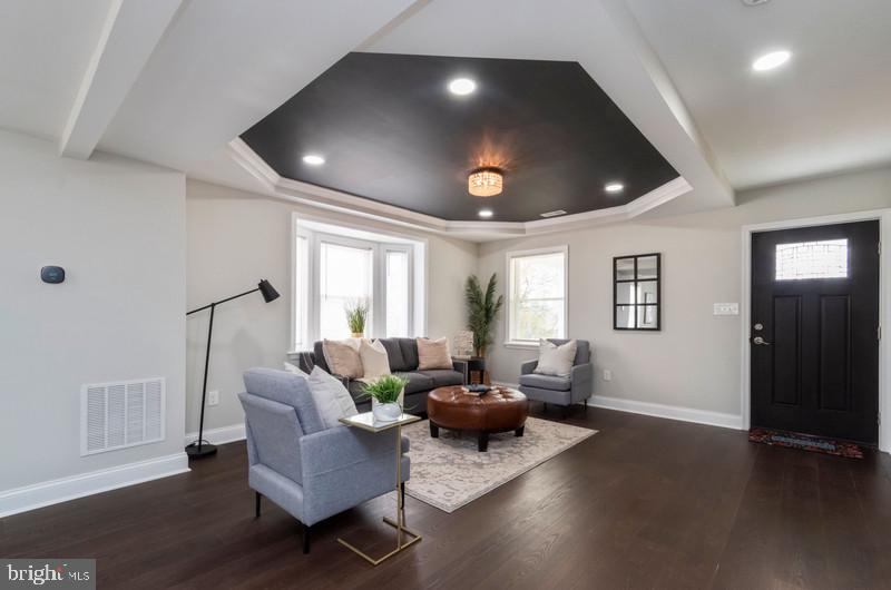 1426 East Cold Spring Lane Baltimore, MD 21239 - Photo 2 of 27 a living room with furniture and a wooden floor