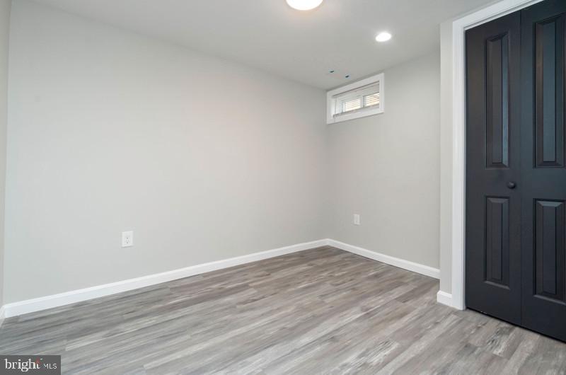 1426 East Cold Spring Lane Baltimore, MD 21239 - Photo 21 of 27 a view of an empty room with wooden floor
