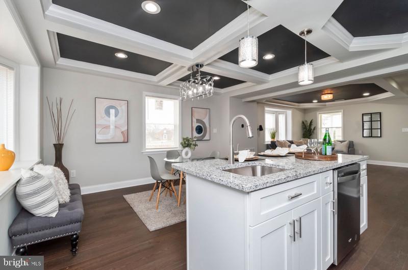 1426 East Cold Spring Lane Baltimore, MD 21239 - Photo 7 of 27 a view of a kitchen area with furniture and wooden floor