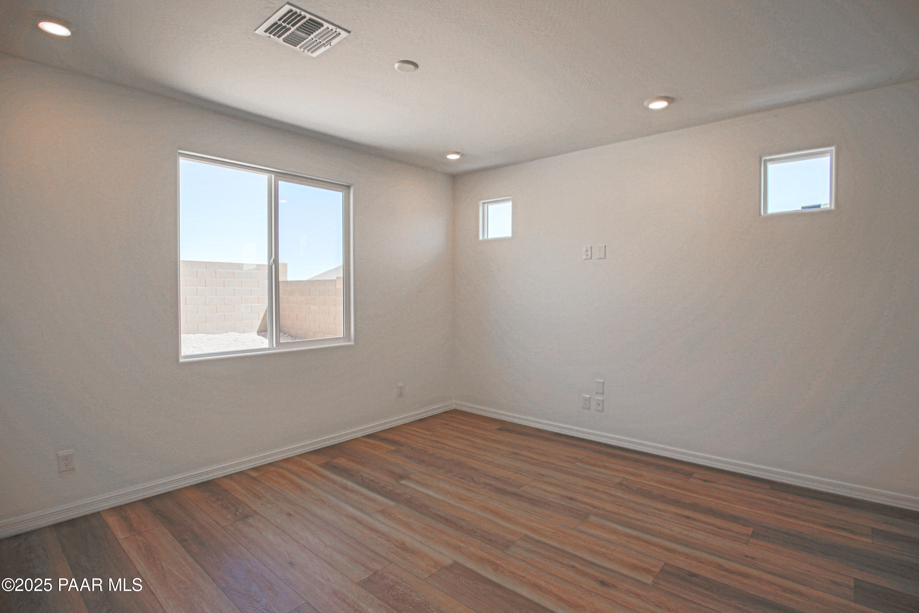 1224 Woodchute Road Prescott, AZ 86305 - Photo 15 of 43 a view of empty room with wooden floor and fan